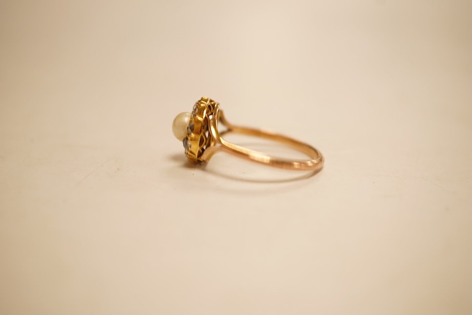 An early 20th century 9ct, cultured pearl and rose cut diamond set circular cluster ring, size O, gross weight 2.8 grams.